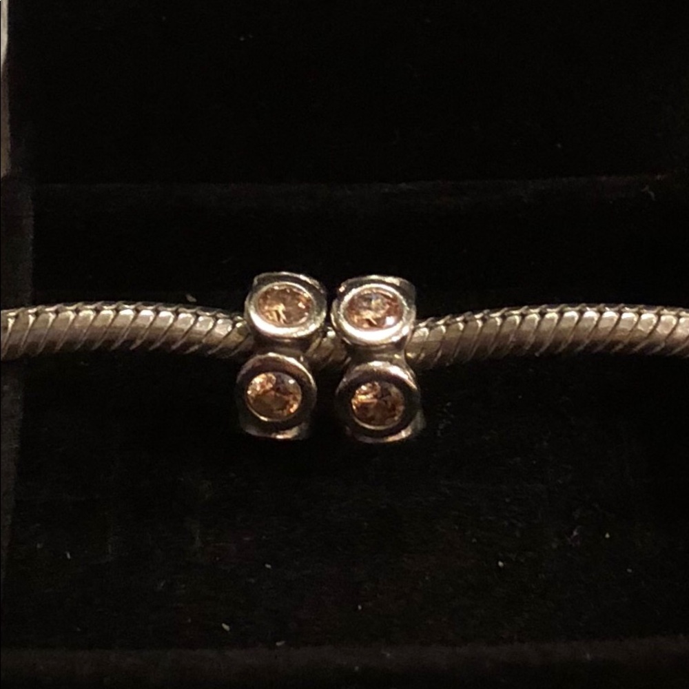 Two Pandora honey stone spacers